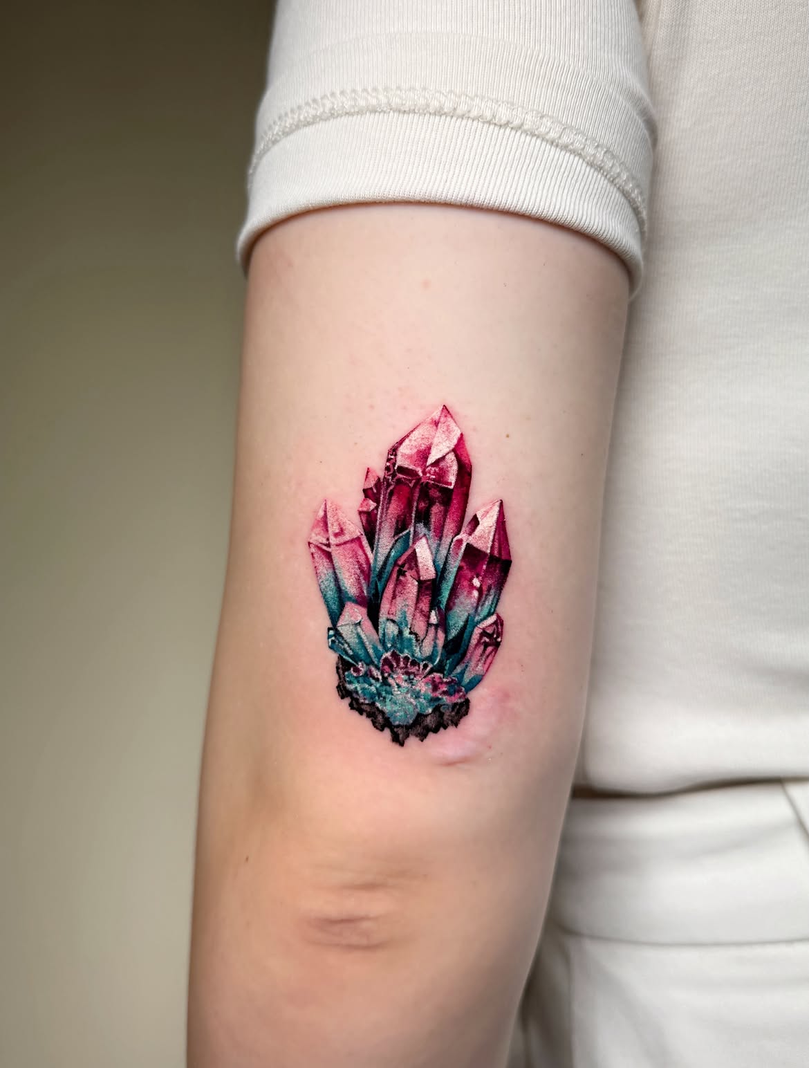 25 Crystal Tattoo Ideas: From Delicate Gemstones to Colorful Botanical Designs