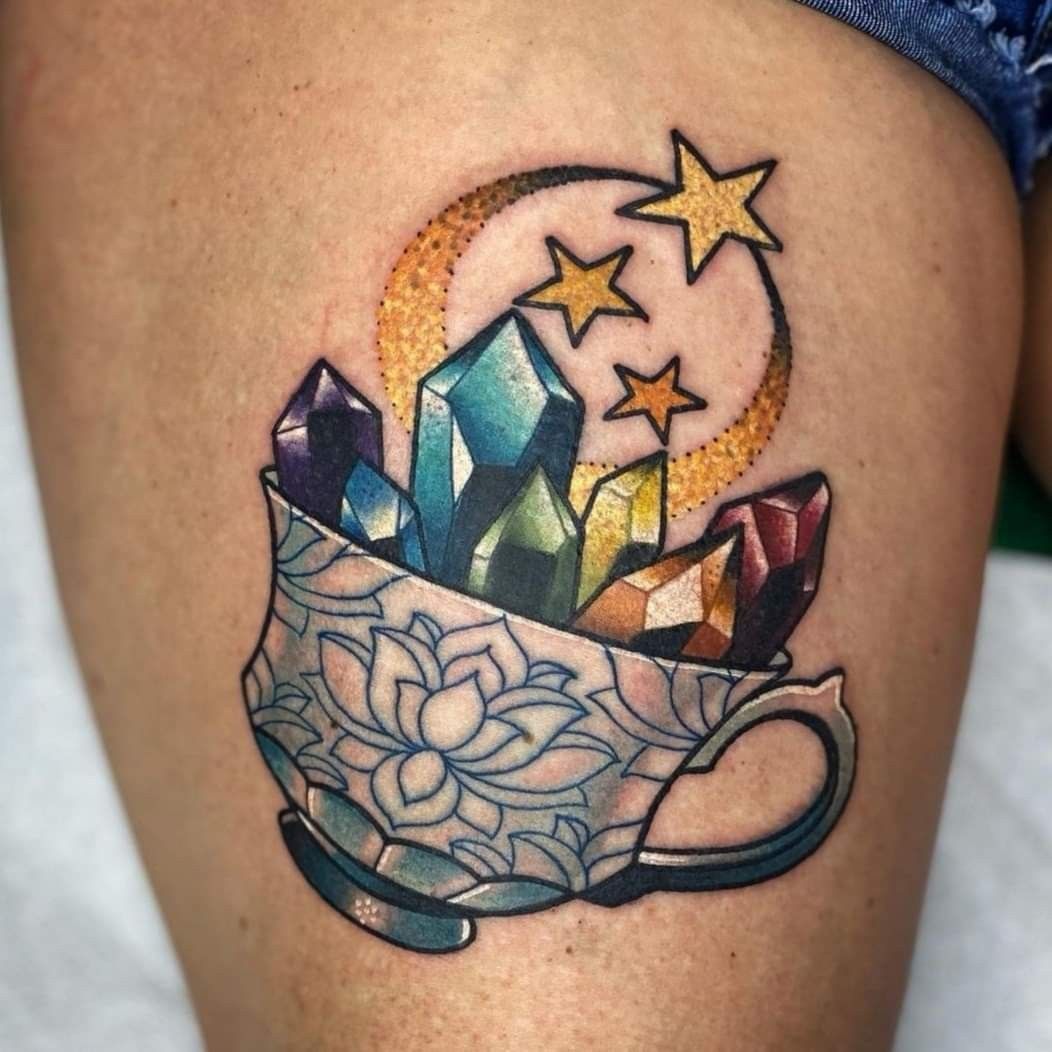25 Crystal Tattoo Ideas: From Delicate Gemstones to Colorful Botanical Designs