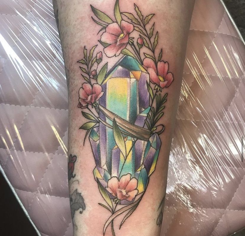 25 Crystal Tattoo Ideas: From Delicate Gemstones to Colorful Botanical Designs