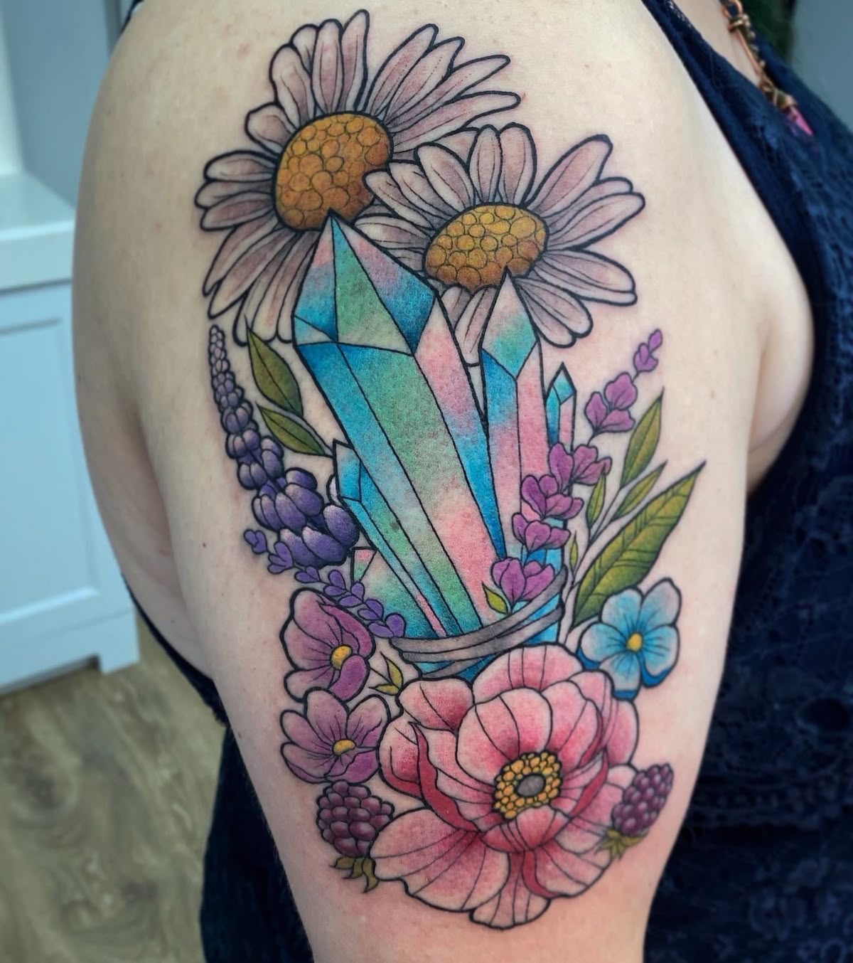 25 Crystal Tattoo Ideas: From Delicate Gemstones to Colorful Botanical Designs